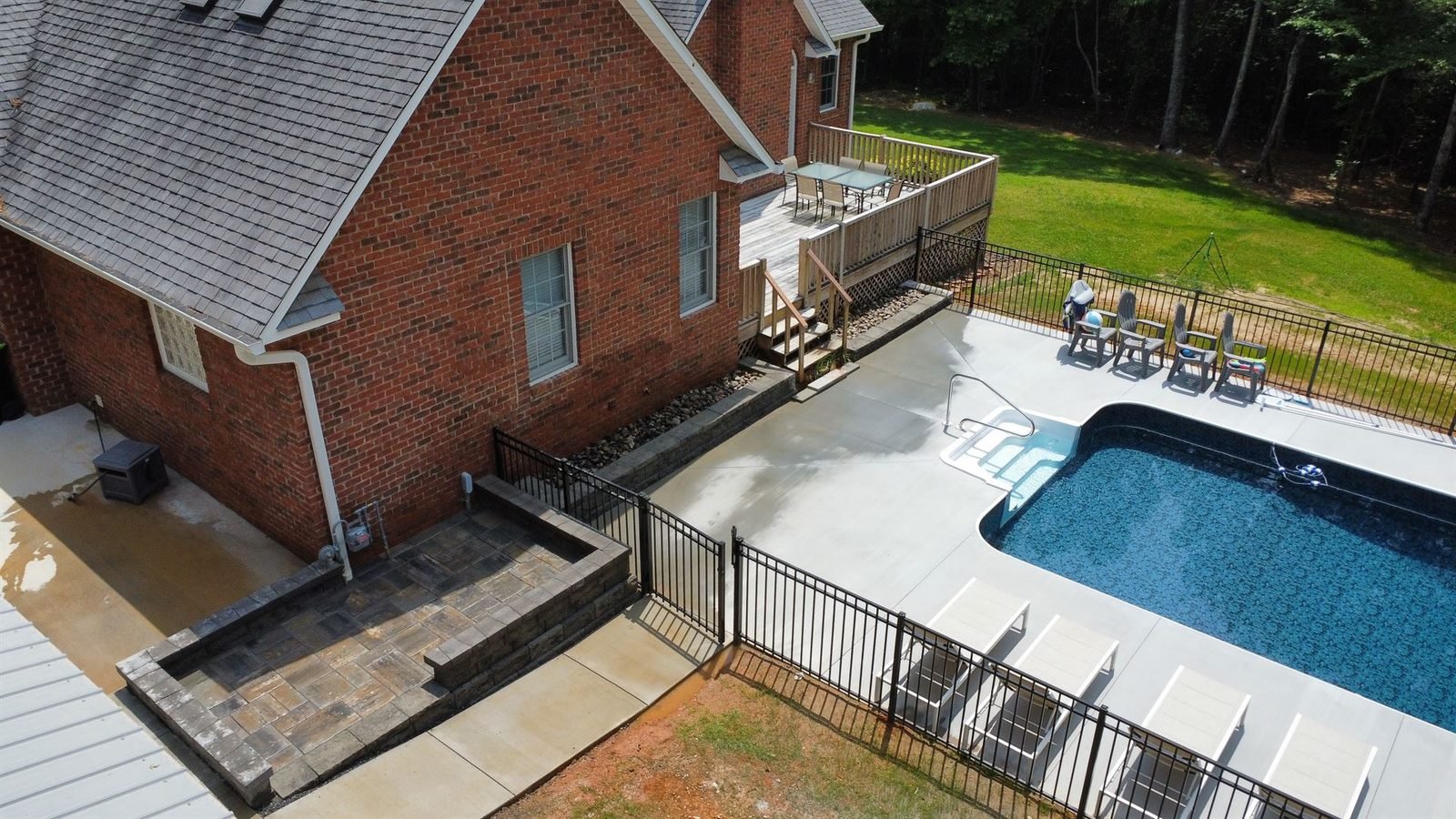 Aerial view of completed pool paver patio and retaining wall Western NC